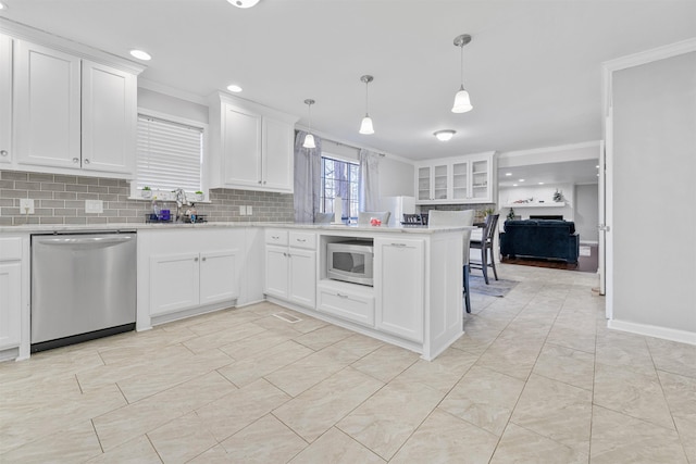 kitchen with appliances with stainless steel finishes and white cabinets