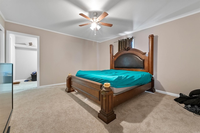 carpeted bedroom featuring ornamental molding and ceiling fan