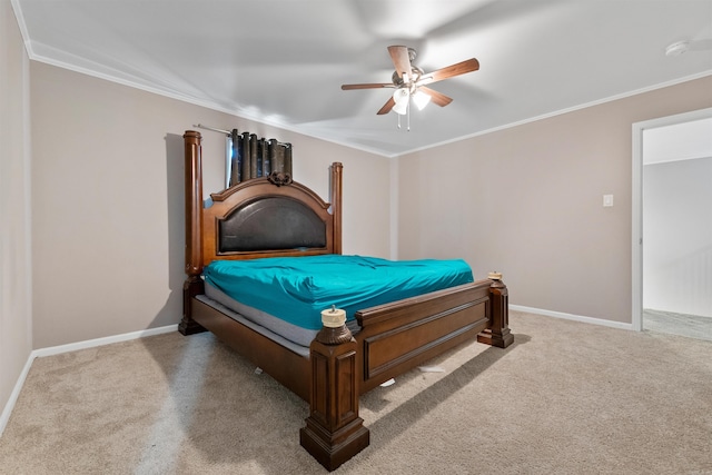 bedroom with ornamental molding, light colored carpet, and ceiling fan