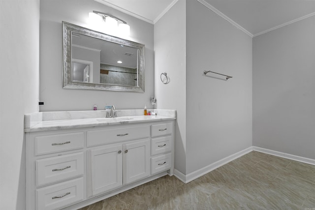 bathroom featuring ornamental molding and vanity