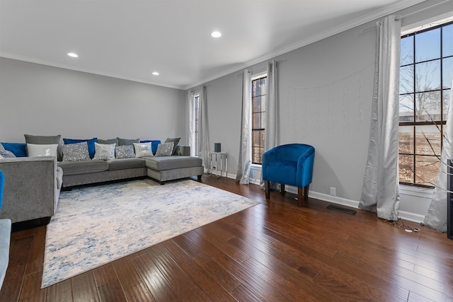 living room with dark hardwood / wood-style flooring and ornamental molding