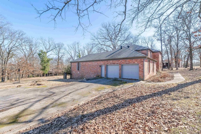 view of side of property with a garage