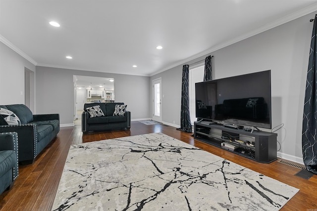 living room with ornamental molding and dark hardwood / wood-style flooring