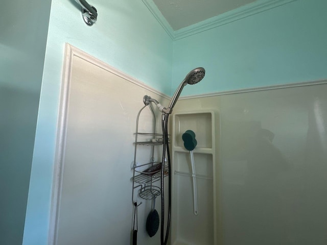 interior details with crown molding and walk in shower