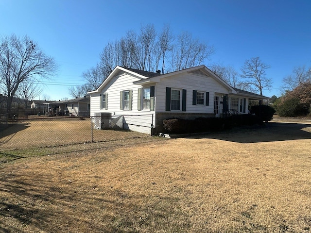 view of front of property with central air condition unit and a front lawn