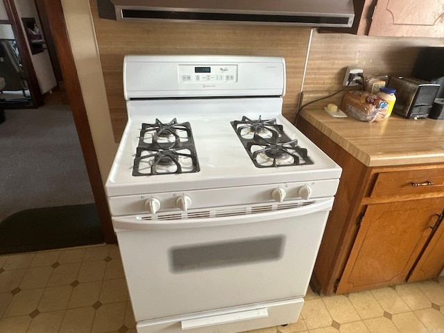 kitchen with white gas stove