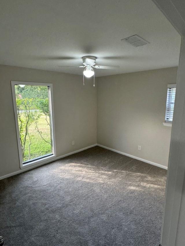 carpeted empty room with ceiling fan