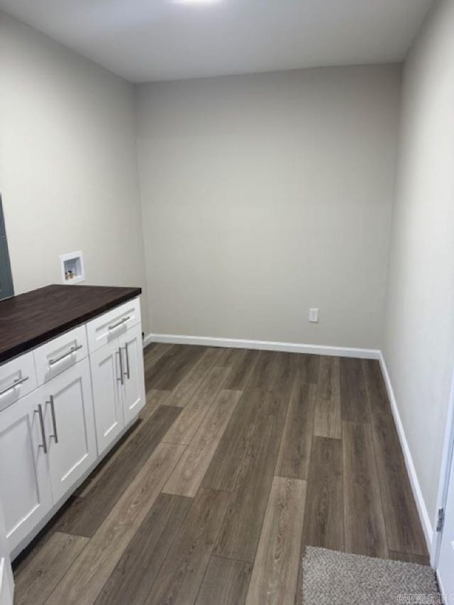 interior space with white cabinetry and dark hardwood / wood-style floors