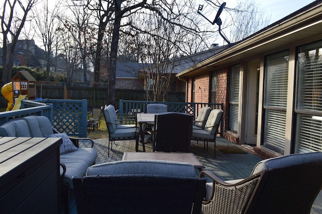 view of patio / terrace with an outdoor hangout area, a playground, and a deck