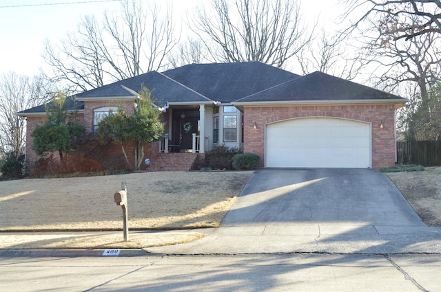 ranch-style home featuring a garage