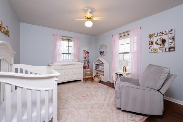 bedroom with wood-type flooring and ceiling fan