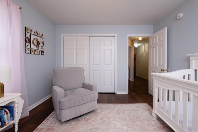 bedroom with hardwood / wood-style floors and a closet