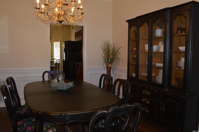 dining area with an inviting chandelier