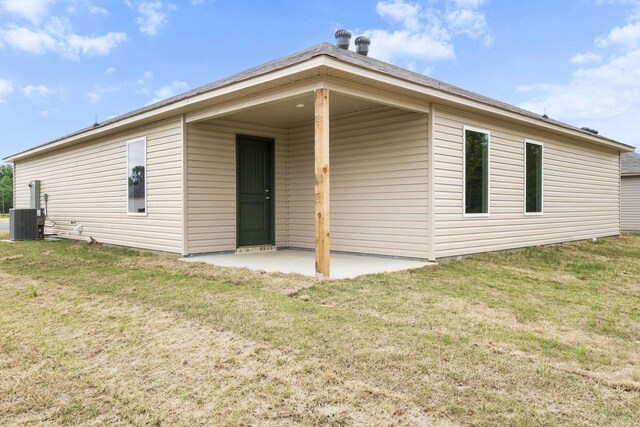 29 Doe Run Dr, Ward, AR 72176 - back of property featuring a lawn, a patio area, and cooling unit
