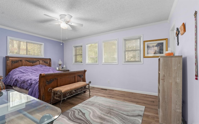 bedroom featuring crown molding, ceiling fan, dark wood-type flooring, and a textured ceiling