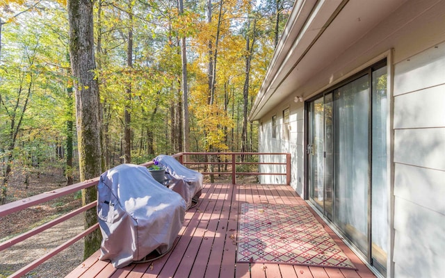 wooden terrace with area for grilling