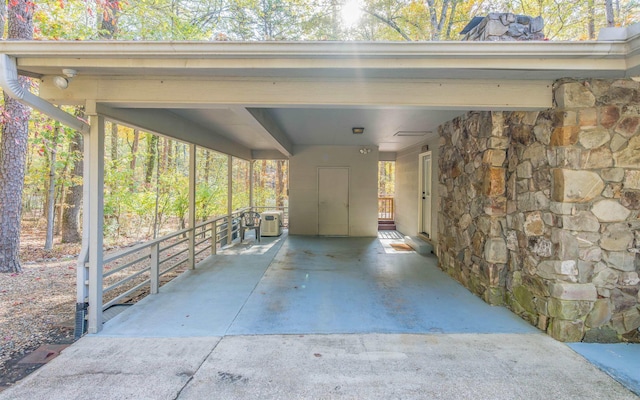 view of vehicle parking featuring a carport