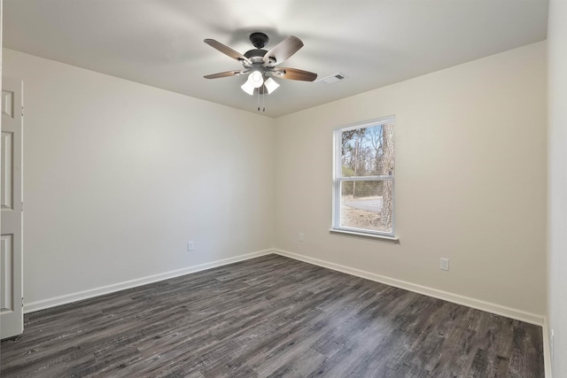 unfurnished room featuring dark hardwood / wood-style floors and ceiling fan