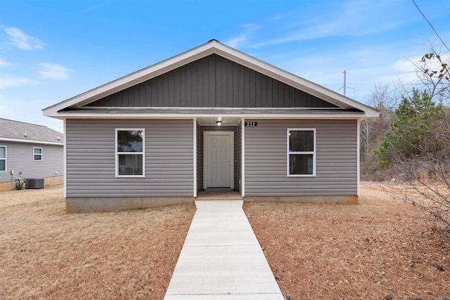 bungalow-style home featuring cooling unit