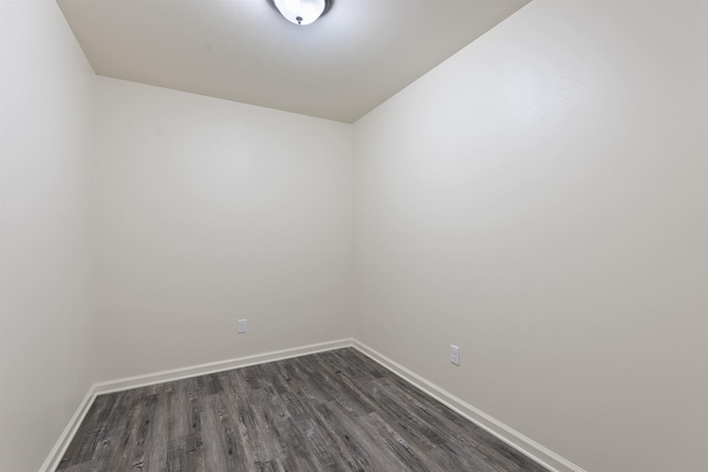 unfurnished room with dark hardwood / wood-style floors