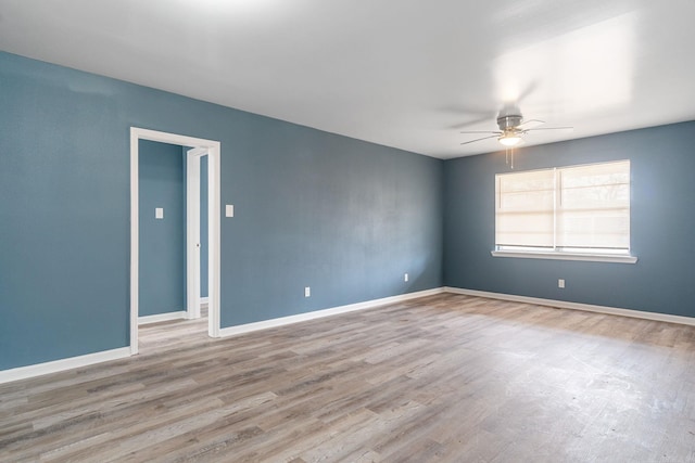 unfurnished room featuring ceiling fan and light wood-type flooring