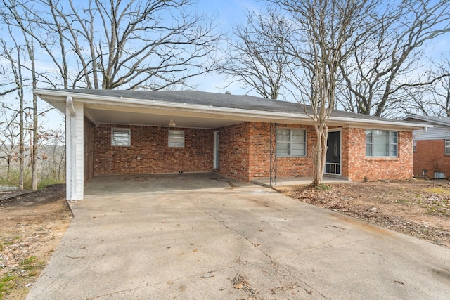 ranch-style home featuring a carport