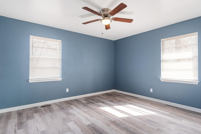 unfurnished room with ceiling fan and light hardwood / wood-style flooring