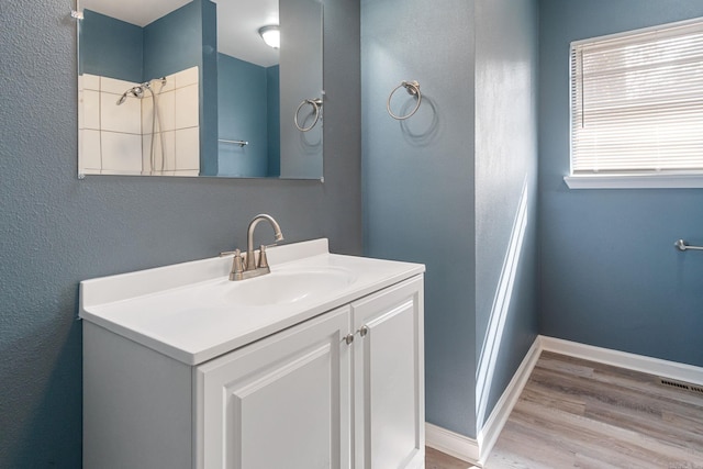 bathroom with vanity and hardwood / wood-style floors