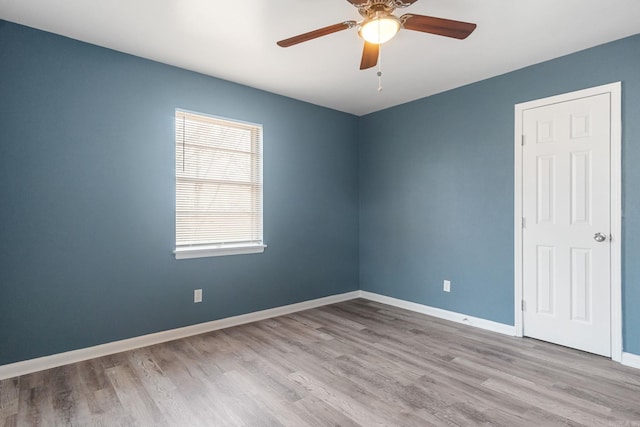 unfurnished room featuring ceiling fan and light wood-type flooring