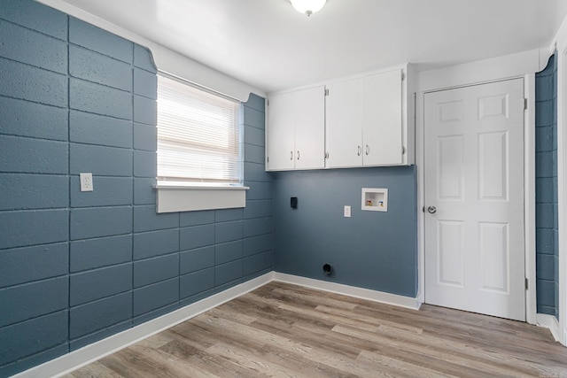 laundry area featuring cabinets, hookup for a washing machine, hookup for an electric dryer, and light hardwood / wood-style flooring