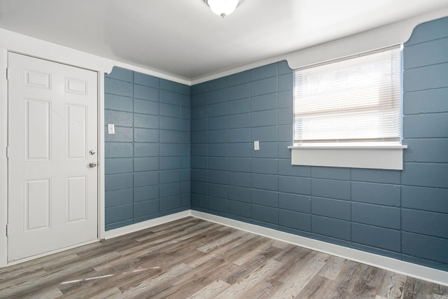 empty room with hardwood / wood-style flooring