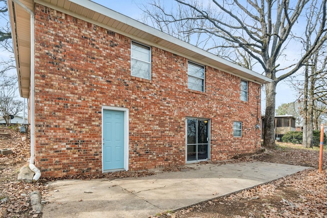 back of house with a patio area