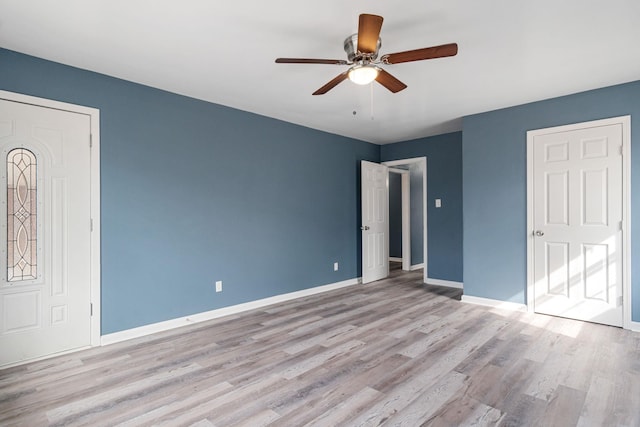 unfurnished bedroom featuring ceiling fan and light wood-type flooring