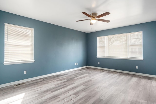 spare room featuring ceiling fan and light wood-type flooring