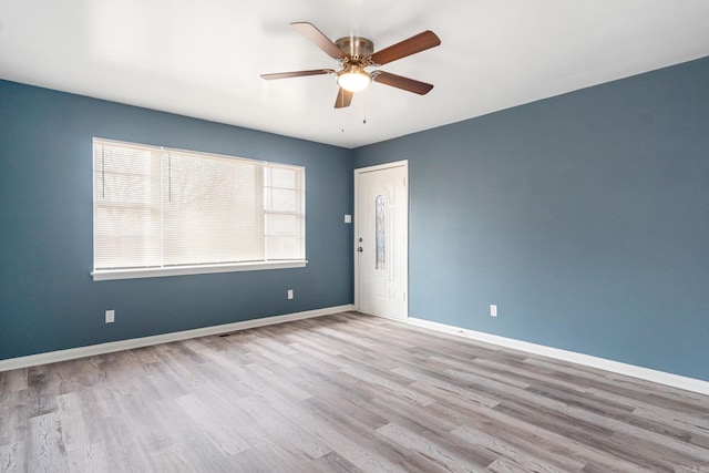 spare room featuring ceiling fan and light hardwood / wood-style floors