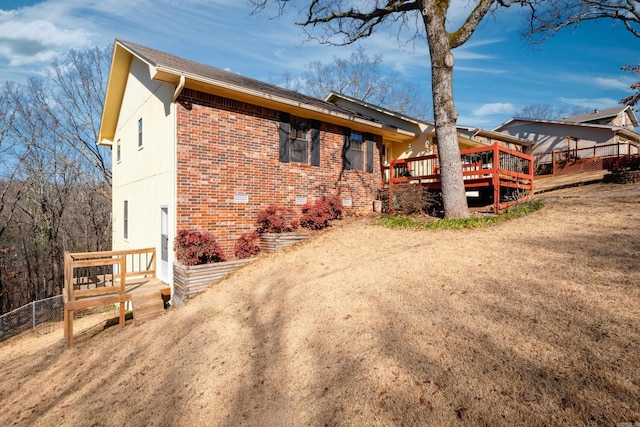 view of home's exterior with a deck