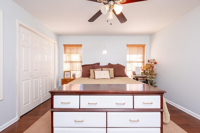 bedroom featuring ceiling fan, dark hardwood / wood-style flooring, and a closet