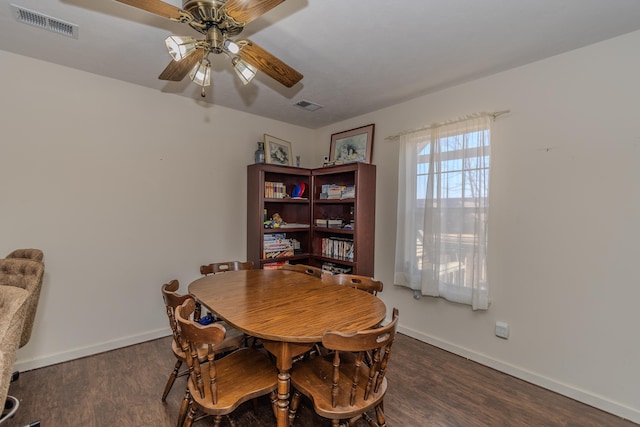 dining room featuring ceiling fan and dark hardwood / wood-style flooring