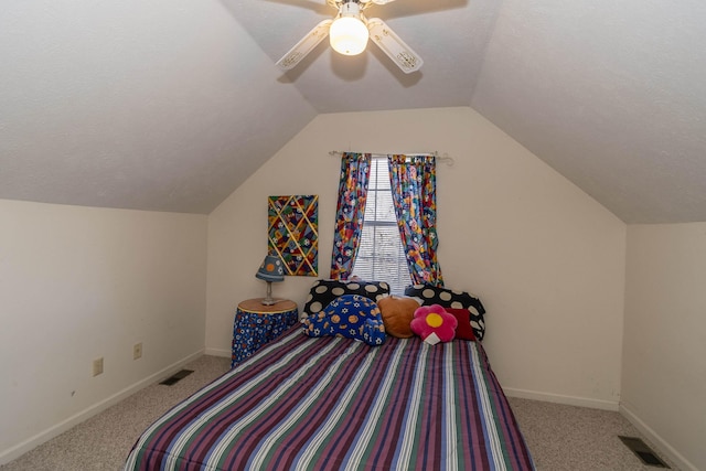 bedroom with ceiling fan, light colored carpet, vaulted ceiling, and a textured ceiling