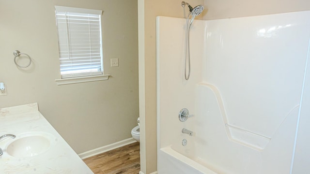 full bathroom with vanity, wood-type flooring, shower / washtub combination, and toilet