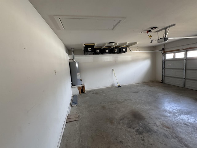 garage with a garage door opener and electric water heater