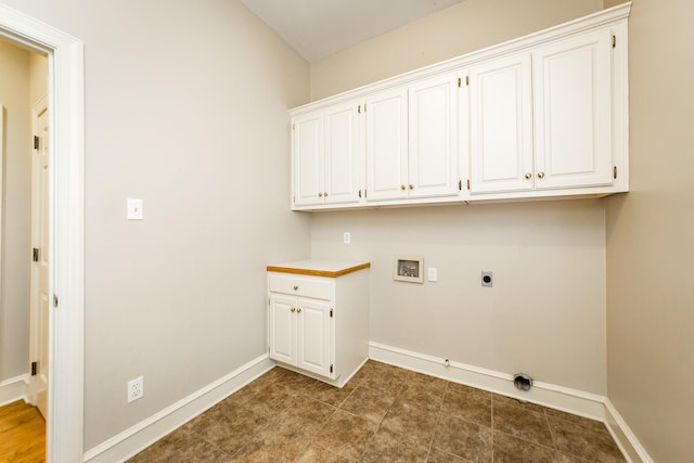 laundry area with cabinets, hookup for a washing machine, and electric dryer hookup