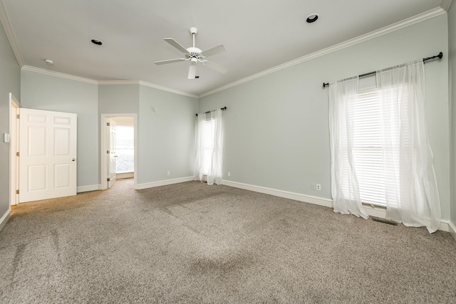 unfurnished bedroom featuring crown molding, light colored carpet, and ceiling fan