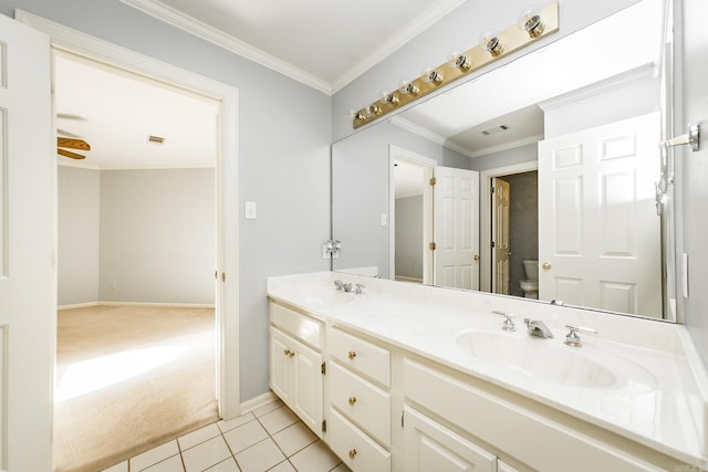 bathroom with vanity, tile patterned floors, ornamental molding, and toilet