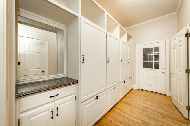 mudroom with crown molding and light wood-type flooring