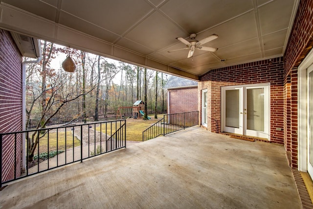 view of patio with a playground and ceiling fan