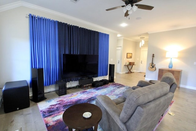 living room featuring ornamental molding, lofted ceiling, wood-type flooring, and ceiling fan