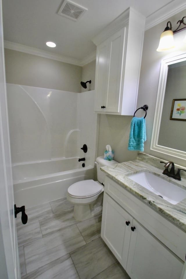 full bathroom with shower / bath combination, vanity, ornamental molding, and toilet