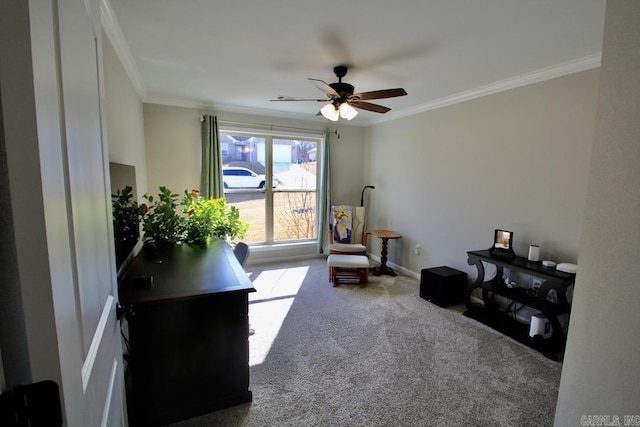 office space with ornamental molding, carpet flooring, and ceiling fan