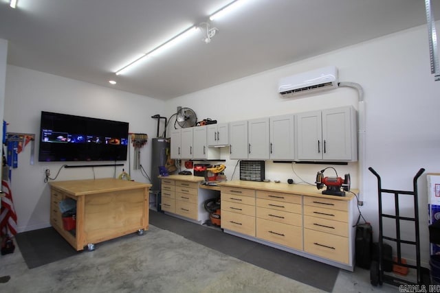 garage featuring a wall mounted air conditioner and a workshop area